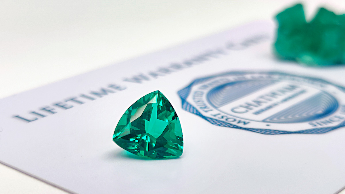 trillion-cut Chatham lab-grown emerald with Chatham Lifetime Warranty Card