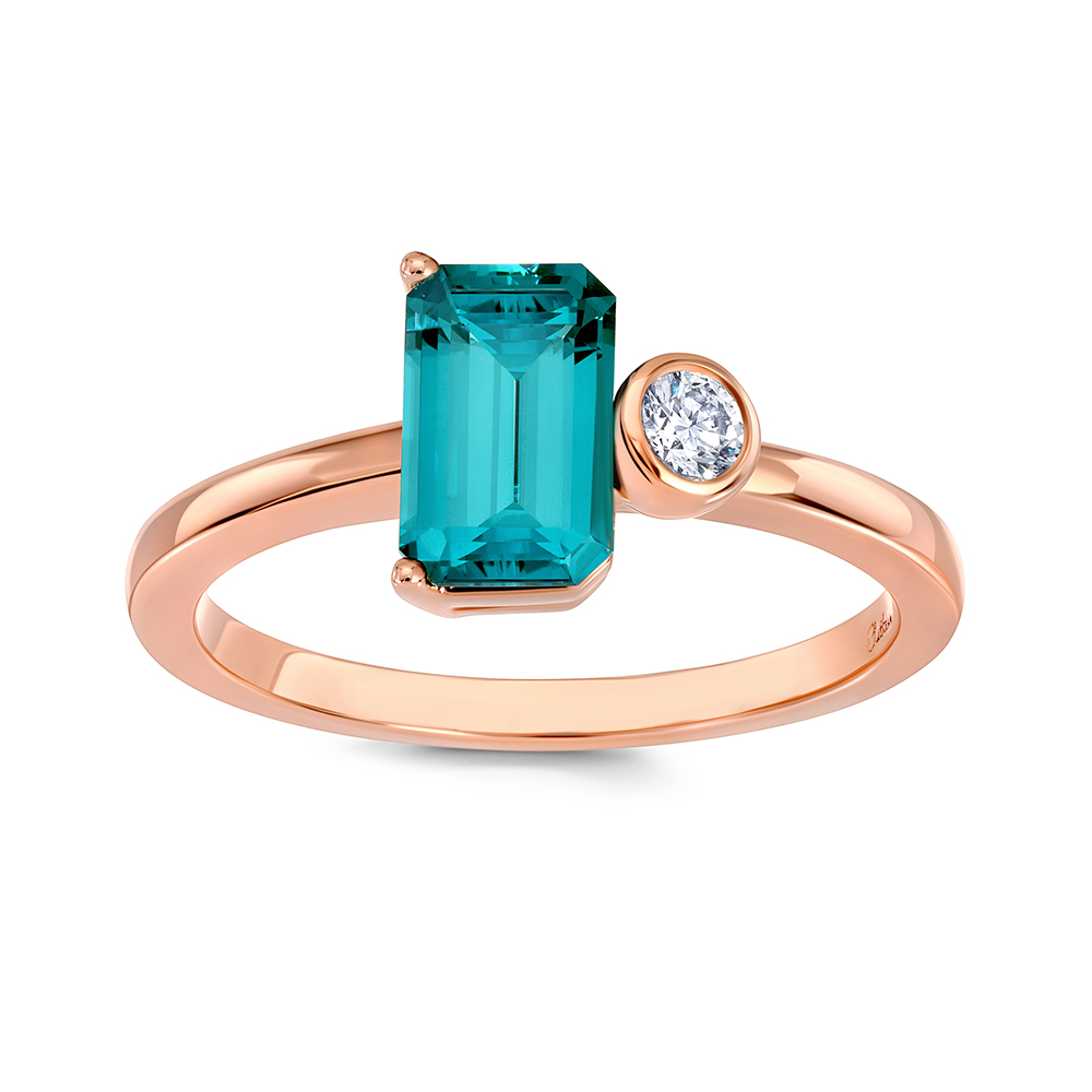 Emerald cut Chatham lab grown Paraíba Colored Spinel ring set in 14K rose gold with bezel set Chatham lab grown diamond