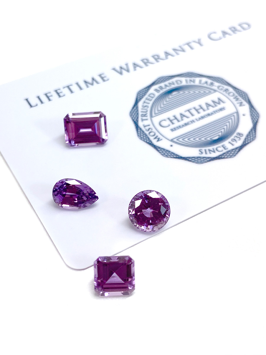 Chatham lab grown purple sapphire gemstones with Chatham Lifetime Warranty card