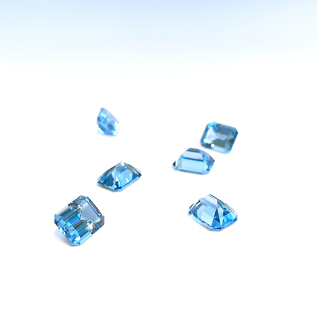 Emerald cut lab grown aqua blue spinel