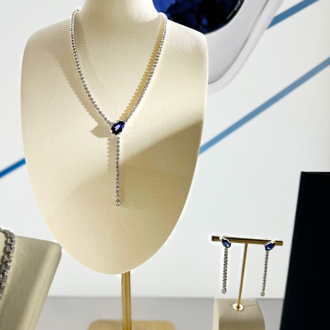 18K white gold pear Chatham lab grown sapphire and diamond necklace with matching drop earrings