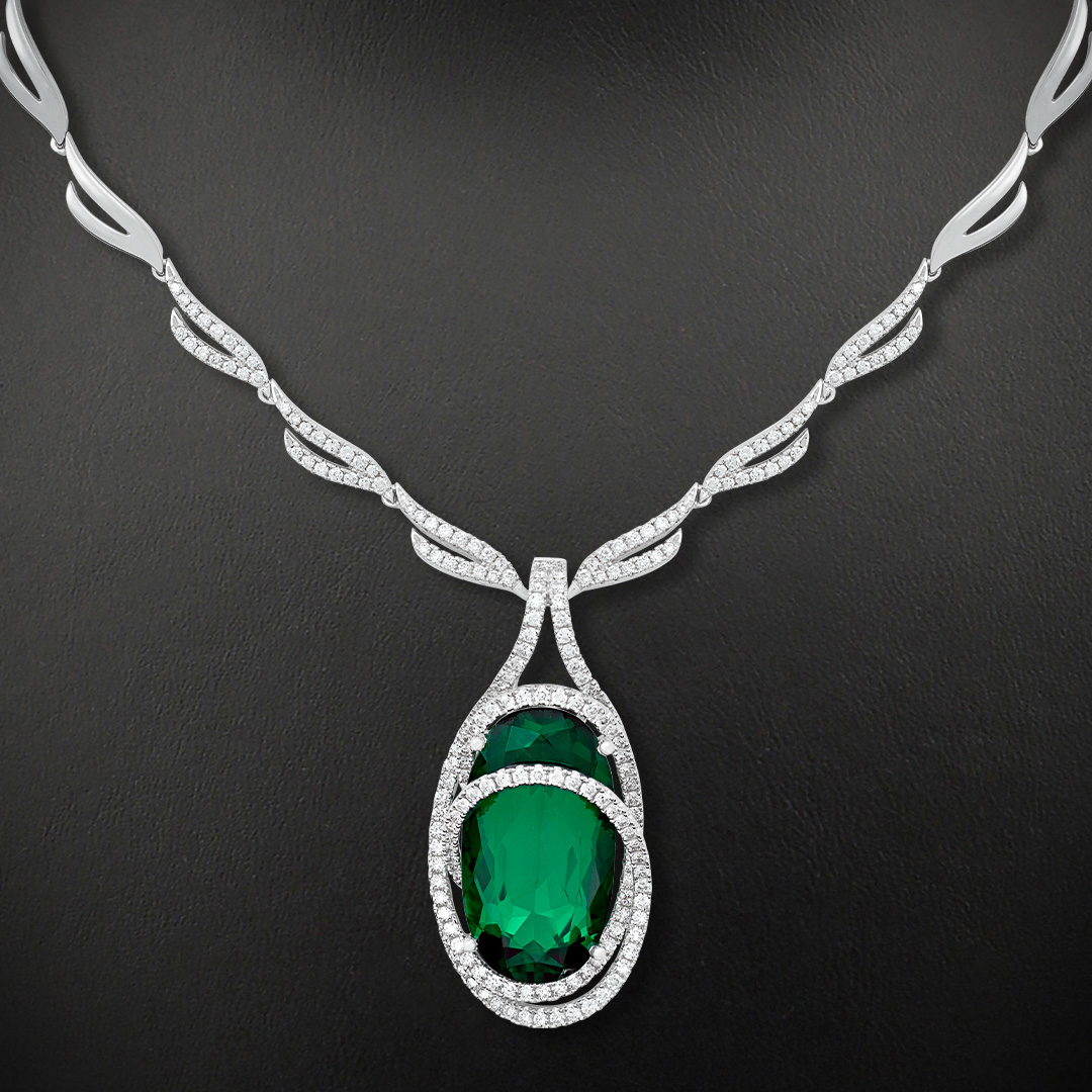 14K white gold Chatham lab grown diamond necklace featuring a 13.91-carat oval Chatham lab grown emerald